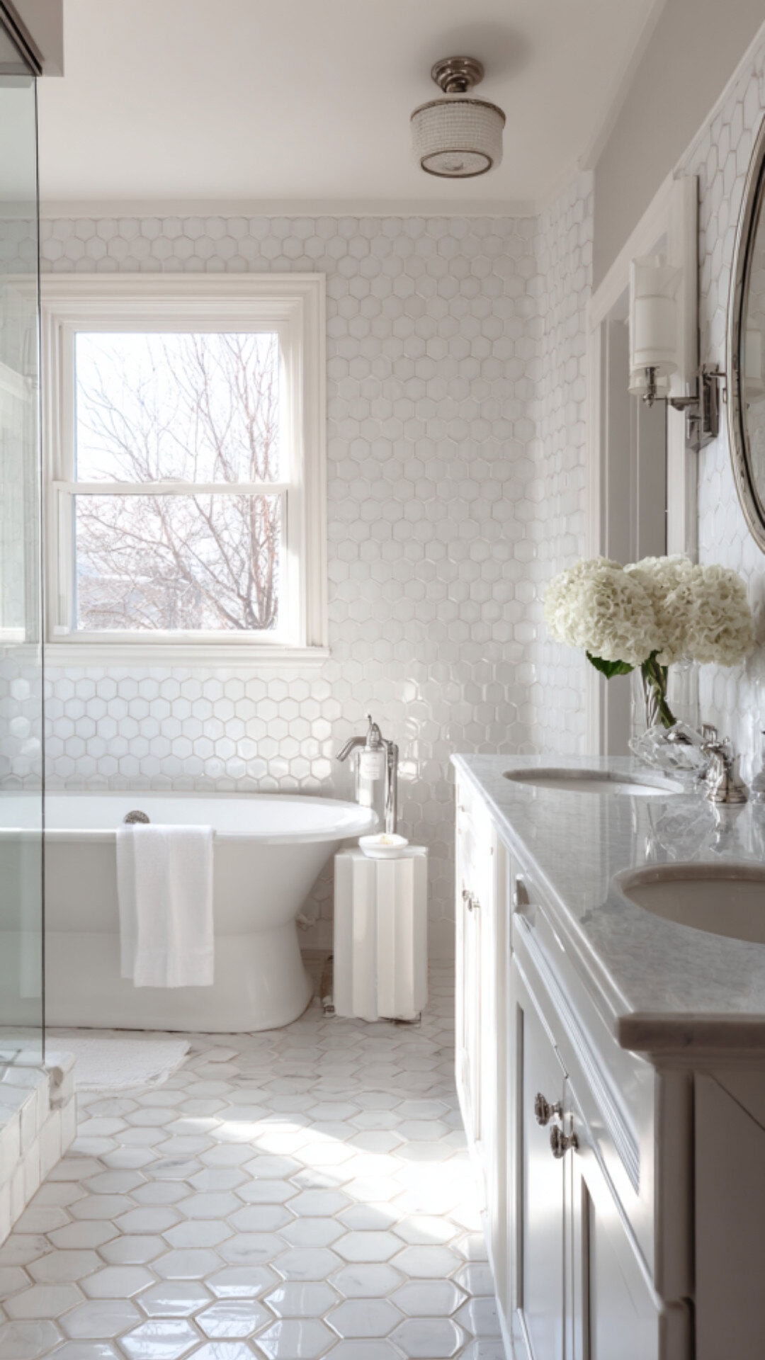 2. White Hexagon Tile Bathroom with Crisp Clean Style