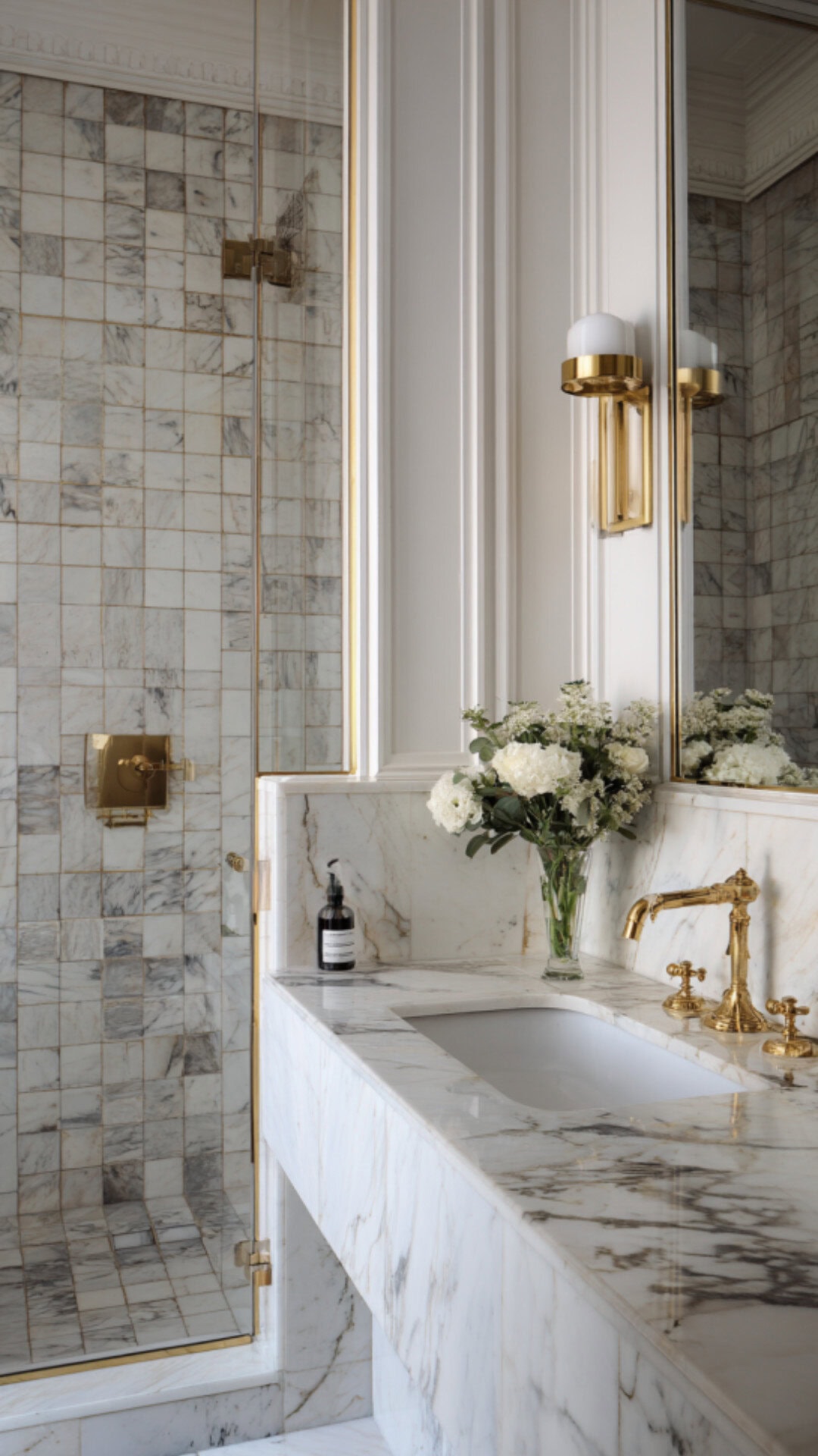 6. Marble Wainscoting Bathroom with Luxury Appeal
